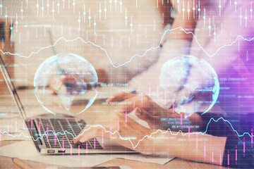 Multi exposure of woman hands typing on computer and financial chart hologram drawing. Stock market analysis concept.