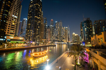 Fototapeta na wymiar UAE, Dubai - December, 2020: Dubai Marina illuminated at night. United Arab Emirates