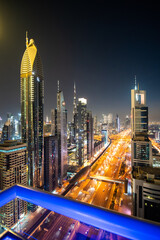 Fototapeta na wymiar UAE, Dubai - December, 2020: View of Sheikh Zayed Road skyscrapers in Dubai, UAE. More than 25 skyscrapers can be found here.