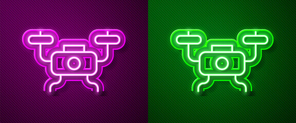 Glowing neon line Drone flying icon isolated on purple and green background. Quadrocopter with video and photo camera symbol. Vector.