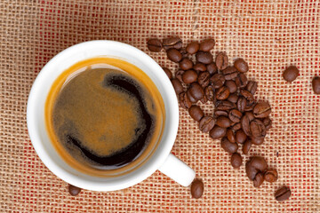 a cup of coffee with beans