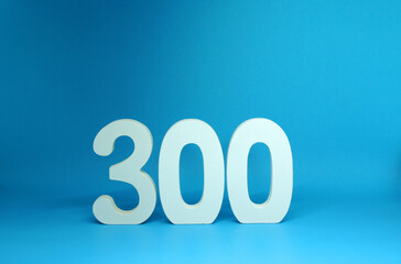300 ( three hundred ) word Isolated Blue Background with Copy Space - Number 300% Percentage or...