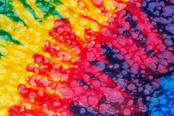 colorful tie dye pattern hand dyed on cotton fabric abstract texture background.