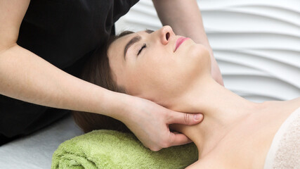 Obraz na płótnie Canvas Neck and throat massage. Strong finger pressure the skin.