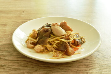 stir fried chicken with slice ginger and black ear mushroom on plate