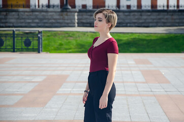 A girl walks on the street in the square