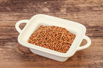 Raw buсkwheat cereal in the bowl