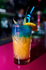 A vertical shot of tropical cocktail drink in the bar