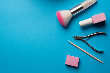 Set of manicure tools and accessories on a blue background. Hardware manicure,Flat lay.