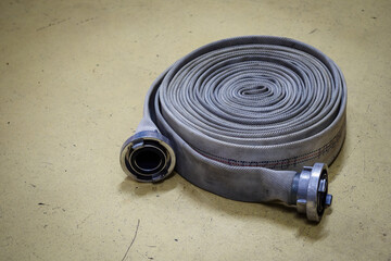 Twisted fire gray hose with end piece. 