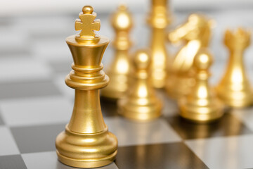 king of chess pieces on a chessboard. concept for strategy, business victory.