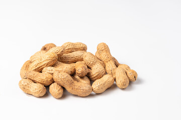 Dried peanuts in closeup isolated on white background. Copy space