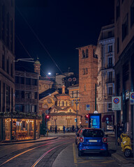 Fototapeta na wymiar The church behind the corner of the Duomo of Milan by night