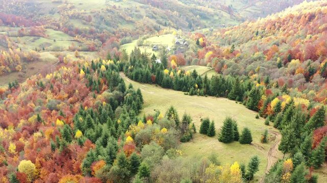 Sky with white and fluffy layer of clouds over green autumn hills, Aerial UHD 4K drone realtime video, shot in 10bit HLG and colorized