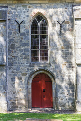 Fototapeta na wymiar Red door in the historic church of Weerselo, Netherlands
