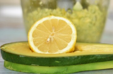 Fototapeta na wymiar avocado blender and lemon close up