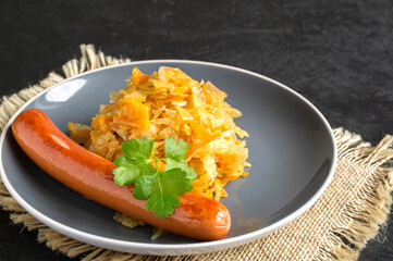 braised pickled cabbage with grilled sausage.