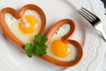  sausage with scrambled egg in the shape of a heart.