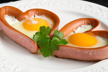  sausage with scrambled egg in the shape of a heart.