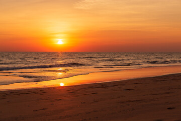 Fototapeta na wymiar Beautiful sunset. Landscape of island beach. Colorful ocean beach sunset.