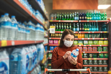 Fototapeta premium Portrait of beautiful girl wearing protective medical mask