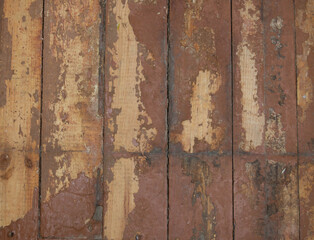 old wooden floor with scraped brown paint