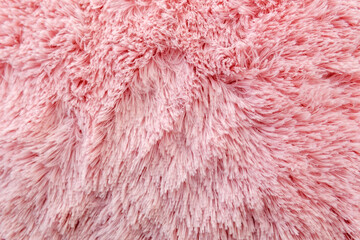 Pink texture of long wool close-up carpet. background. fluffy fur for designers, close-up.