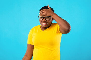 Sick African Woman Having Fever Touching Forehead Over Blue Background