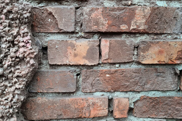 Texture of old red brick wall close-up.