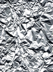 blurred metallic gray background of a crumpled aluminum foil