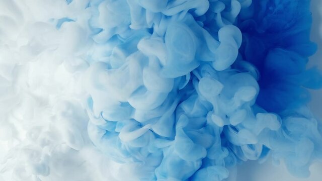 White and Blue cloud abstract ink mixed in water.