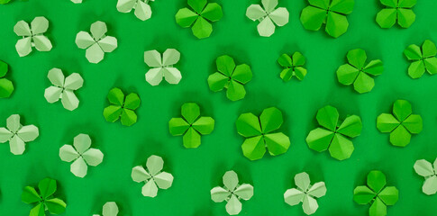 Saint Patrick's day banner with origami clovers leaves. Holiday symbol.