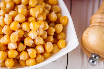 boiled chickpeas on a white wooden rustic background