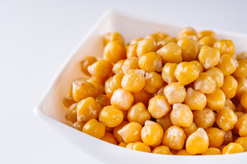 boiled chickpeas on a white acrylic background