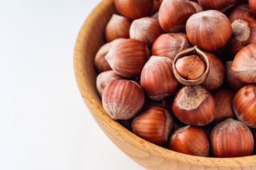 fresh natural hazelnuts on a white acrylic background