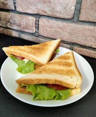  juicy sandwich against a brick wall