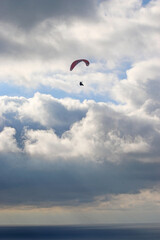 Storm Clouds and paraglider above Whitsand Bay, Cornwall
