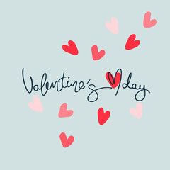 Valentines Day greeting card. Hand-lettered greeting phrase and multicolored heart shapes on light blue background