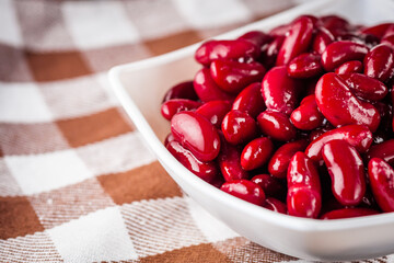 canned red kidney beans on a dark wooden rustic background