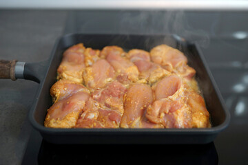 Spiced chicken thighs in a grill pan