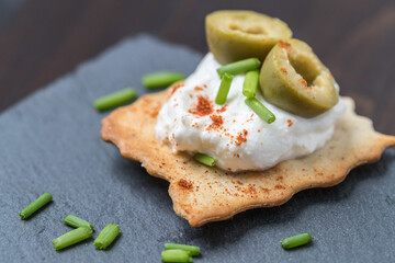 bite of olives and cream cheese