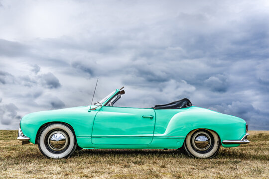 BOSSCHENHOOFD/NETHERLANDS-JUNE 11, 2018: side view of a mint green classic kamann ghia convertible at a classic car meeting