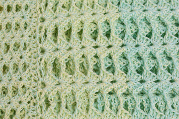 handmade multicolor crochet background in green and yellow with double crochet stitches