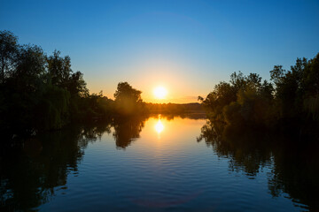Fototapeta na wymiar beautiful sunset at Alz river, Truchtlaching