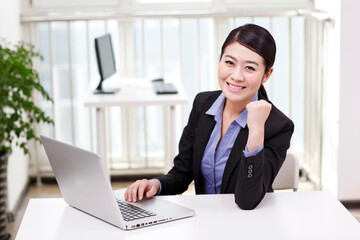 A young Business woman using a laptop 