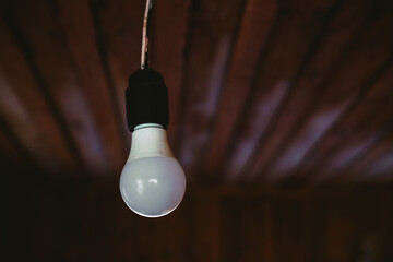 Edison light bulb on dark background