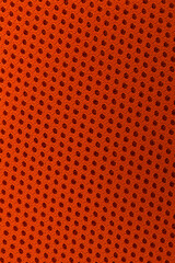 Texture of orange fabric as background, top view