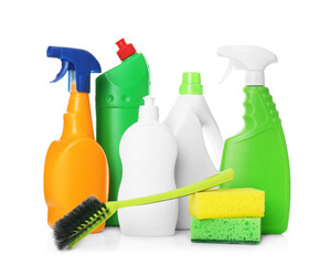 Different cleaning products and tools on white background