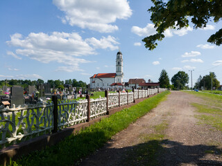 All Saints orthodox church and graveyard in Bosanski Lužani near Derventa, Bosnia and Herzegovina during sunny day