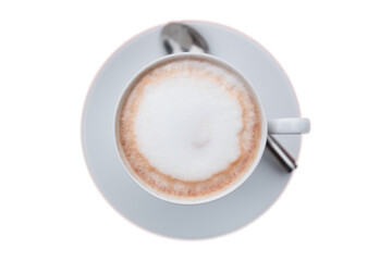 Cappuccino or latte with frothy foam, blue coffee cup top view closeup isolated on white background.